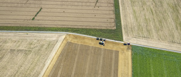 Aerial view, harvesting vehicles with straw bales in Ruploh, grain harvest, fields, Soest, Soester Börde, North Rhine-Westphalia, Germany, DE, Europe, birds-eyes view, aerial photography, aerial photography, overview, overview, bird's eye view