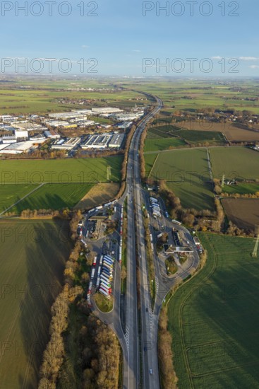 Aerial view, motorway A44, service area Soester Börde, industrial area Soest South-East, Müllingsen, Soest, Soester Börde, North Rhine-Westphalia, Germany, motorway service area, DE, Europe, commercial enterprises, commercial area, commercial park, commercial location, commercial use, industrial area, industrial building, industrial site, aerial view, aerial photography, aerial photography, Niederbergheimer Staße, rest area, rest stop, Soester Böre Nord, Soester Böre Süd, overview, traffic volume, bird's eye view, birds-eyes view, overview