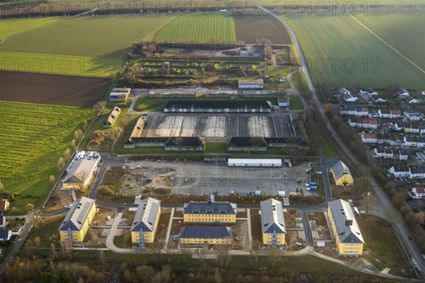Aerial view, construction area former Kanaal van Wessem barracks, housing estate and refugee accommodation, Soest, Soester Börde, North Rhine-Westphalia, Germany, construction work, construction area, building site, building plots, construction project, construction site, DE, Europe, property tax, Hiddingser Weg, real estate, capacity requirements, aerial photograph, aerial photography, aerial photography, overview, bird's eye view, housing estate, living and living, residential area, residential buildings, residential neighbourhood, bird's eye view, overview