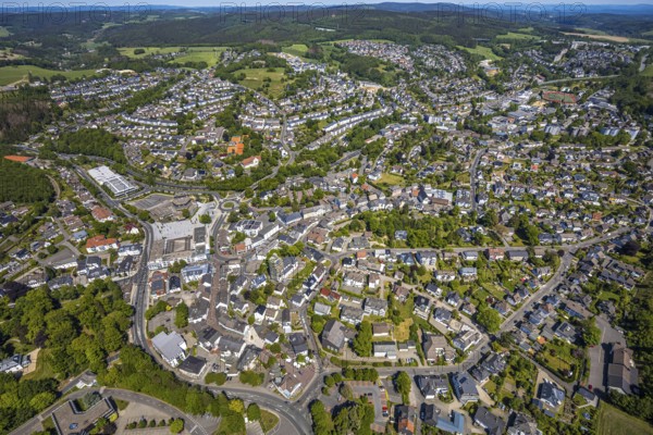 Aerial view, town view, town hall, construction site renovation Jesus-Christus-Kirche, Meinerzhagen, Märkischer Kreis, Sauerland, North Rhine-Westphalia, Germany, place of worship, construction work, construction project, city, DE, Europe, distant view, religious community, place of worship, hilly landscape, city centre, church, parish, denomination, roundabout, culture, art, aerial view, aerial photography, aerial photography, renovation, redevelopment, townscape, city area, city centre, overview, events, event location, event venue, event centre, bird's-eye view, residential area, birds-eyes view, cultural use, overview