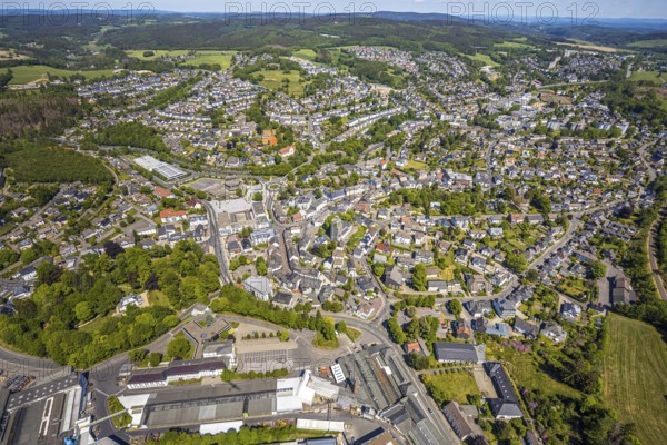 Aerial view, town view, town hall, construction site renovation Jesus-Christus-Kirche, Meinerzhagen, Märkischer Kreis, Sauerland, North Rhine-Westphalia, Germany, place of worship, construction work, construction project, city, DE, Europe, distant view, religious community, place of worship, hilly landscape, city centre, church, parish, denomination, roundabout, culture, art, aerial view, aerial photography, aerial photography, renovation, redevelopment, townscape, city area, city centre, overview, events, event location, event venue, event centre, bird's-eye view, residential area, birds-eyes view, cultural use, overview