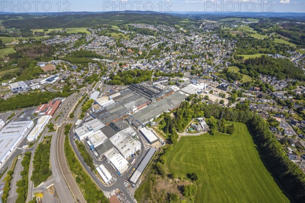 Aerial view, OTTO FUCHS metal processing company, Meinerzhagen railway station, Meinerzhagen, Märkischer Kreis, Sauerland, North Rhine-Westphalia, Germany, railway station, DE, Deutsche Bahn AG, Europe, commercial enterprises, commercial area, commercial park, commercial location, commercial use, industrial area, industrial location, aerial photograph, aerial photography, aerial photography, overview, bird's-eye view, bird's-eye view, overview