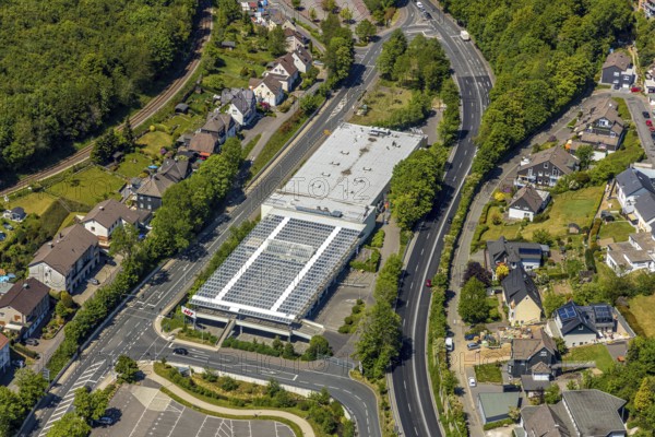 Aerial view, shopping centre HIT Handelsgruppe GmbH, Meinerzhagen, Märkischer Kreis, Sauerland, North Rhine-Westphalia, Germany, federal road B54, DE, shopping markets, shopping place, shopping centre, Europe, aerial view, aerial photography, aerial photography, local supply centre, supermarket, overview, bird's eye view, Volmestraße, birds-eyes view, overview
