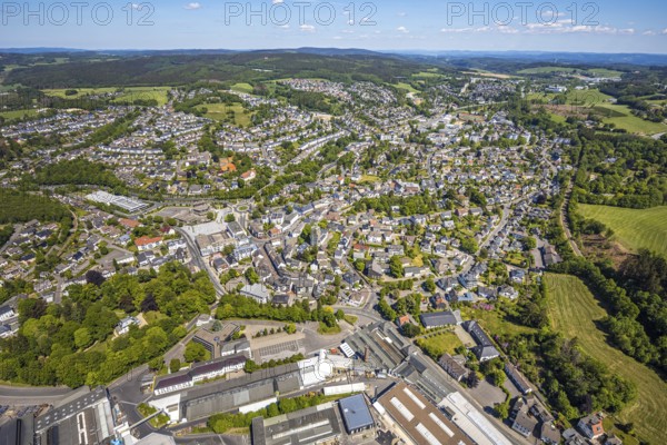 Aerial view, town view, town hall, construction site renovation Jesus-Christus-Kirche, Meinerzhagen, Märkischer Kreis, Sauerland, North Rhine-Westphalia, Germany, place of worship, construction work, construction project, city, DE, Europe, distant view, religious community, place of worship, hilly landscape, city centre, church, parish, denomination, roundabout, culture, art, aerial view, aerial photography, aerial photography, renovation, redevelopment, townscape, city area, city centre, overview, events, event location, event venue, event centre, bird's-eye view, residential area, birds-eyes view, cultural use, overview