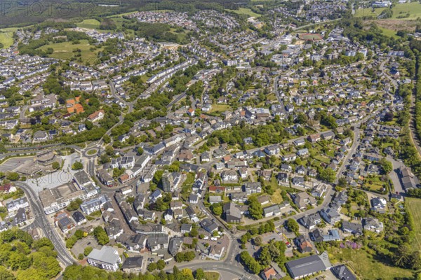Aerial view, town view, town hall, construction site renovation Jesus-Christus-Kirche, Meinerzhagen, Märkischer Kreis, Sauerland, North Rhine-Westphalia, Germany, place of worship, construction work, construction project, city, DE, Europe, distant view, religious community, place of worship, hilly landscape, city centre, church, parish, denomination, roundabout, culture, art, aerial view, aerial photography, aerial photography, renovation, redevelopment, townscape, city area, city centre, overview, events, event location, event venue, event centre, bird's-eye view, residential area, birds-eyes view, cultural use, overview