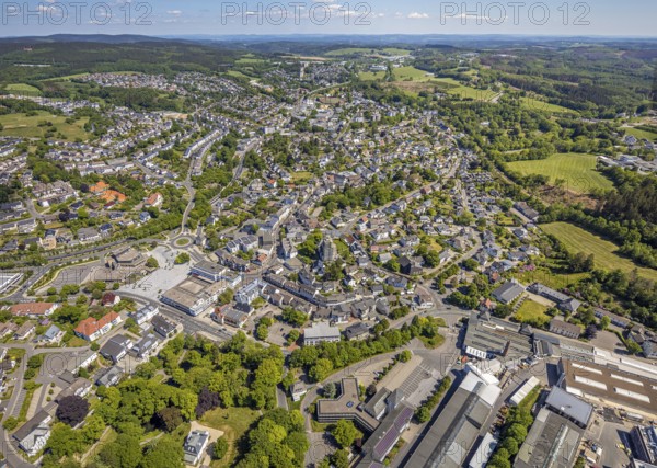 Aerial view, town view, town hall, construction site renovation Jesus-Christus-Kirche, Meinerzhagen, Märkischer Kreis, Sauerland, North Rhine-Westphalia, Germany, place of worship, construction work, construction project, city, DE, Europe, distant view, religious community, place of worship, hilly landscape, city centre, church, parish, denomination, roundabout, culture, art, aerial view, aerial photography, aerial photography, renovation, redevelopment, townscape, city area, city centre, overview, events, event location, event venue, event centre, bird's-eye view, residential area, birds-eyes view, cultural use, overview