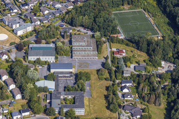 Aerial view, former school centre Bieberberg, sports hall Am Habicht, old secondary school Lendringsen, old secondary school Lendringsen, sports field, Menden, Sauerland, Märkischer Kreis, North Rhine-Westphalia, Germany, DE, Europe, football pitch, football stadium, aerial view, aerial photography, aerial photography, school, sports, sports facilities, sports facility, overview, bird's-eye view, former schools, overview, decommissioned, dilapidated, destroyed building
