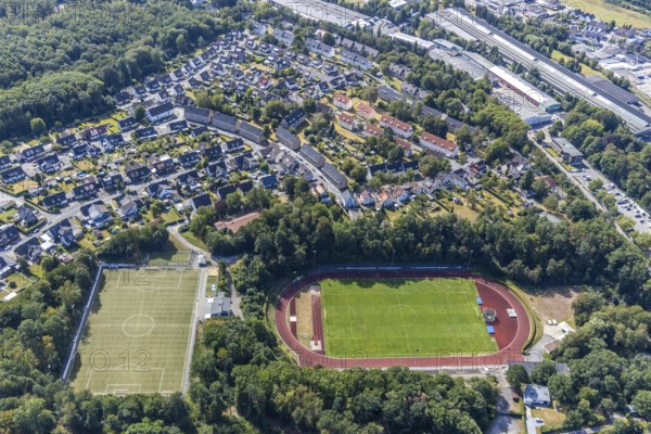 Aerial view, sports field, Huckenohl stadium, Menden, Sauerland, Märkischer Kreis, North Rhine-Westphalia, Germany, DE, Europe, football field, football stadium, Catholic kindergarten Heilig Kreuz, kindergarten, nursery, crèche, day nursery, day care centre, day care centre, athletics stadium, aerial view, aerial photography, aerial photography, Oesberner Weg, sports, sports facilities, sports facility, stadium, overview, bird's eye view, birds-eyes view, overview