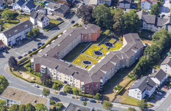 Aerial view, residential complex with green parking roof, inner courtyard, Clemens-Brentano-Straße, Menden, Sauerland, Märkischer Kreis, North Rhine-Westphalia, Germany, DE, Europe, shapes and colours, property tax, real estate, aerial view, aerial photography, aerial photography, parking roof, overview, bird's-eye view, residential complex, living and living, residential area, residential buildings, quality of life, residential quarter, housing estate, green inner courtyard, bird's-eye view, overview
