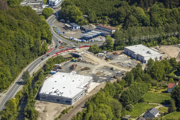 Aerial view, construction site and new building, settlement of local supply centre Edeka sales area and Trinkgut beverage market, district Brügge, Lüdenscheid, Märkischer Kreis, Sauerland, North Rhine-Westphalia, Germany, construction work, construction vehicles, construction area, construction site, building plots, construction crane, construction project, construction site, federal road B54, DE, shopping centre, Europe, commercial buildings, district town, aerial view, aerial photography, aerial photography, overview, bird's eye view, bird's eye view, overview