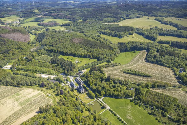 Aerial view, Neuenhof Castle, castle garden, Elspetal, Lüdenscheid, Märkischer Kreis, Sauerland, North Rhine-Westphalia, Germany, architectural monument, castle courtyard, DE, Europe, manor house, manor building, courtyard complex, hilly landscape, aerial photograph, aerial photography, aerial photography, Neuenhofer Straße, castle, castle complex, castle park, overview, bird's-eye view, wooded area, moated castle, moated castle, bird's-eye view, overview