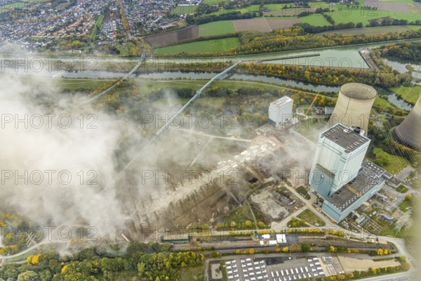 Aerial photo, thousands of spectators watched with great interest as the Gersteinwerk chimney was blown up half an hour late. The 282 metre high RWE chimney fell exactly into the prepared gravel bed. City limits of Werne, Hamm North Rhine-Westphalia, Germany