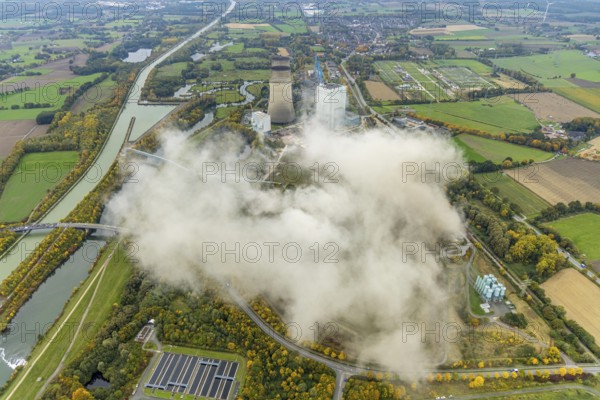 Aerial photo, thousands of spectators watched with great interest as the Gersteinwerk chimney was blown up half an hour late. The 282 metre high RWE chimney fell exactly into the prepared gravel bed. City limits of Werne, Hamm North Rhine-Westphalia, Germany