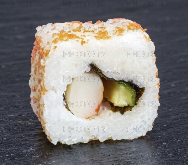 Sushi dish on dark grey stone surface