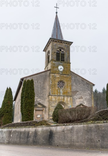 Saint-Georges church in Aydoilles, a commune in the Vosges department in Grand Est in northeastern France at winter time