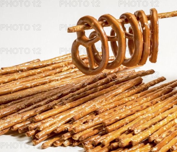 Closeup of some salt sticks and pretzels in light back