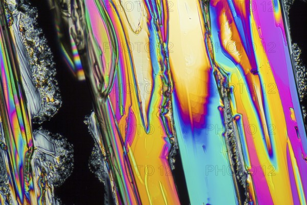 Colorful microscopic shot of Sodium nitrate microcrystals in polarized light