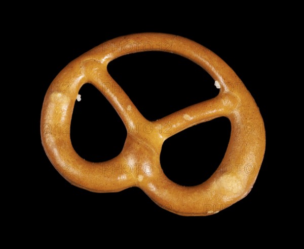 Closeup of a lye pretzel in dark back