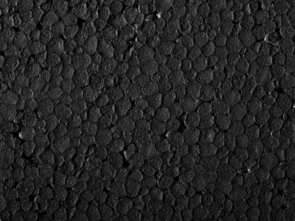 Full frame closeup of a black Polystyrene surface