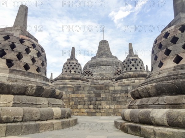 Lots of stupas at a temple named Borobudur located in Java, a island of Indonesia