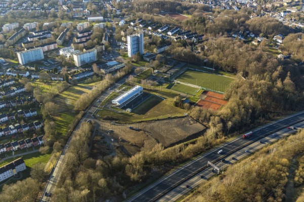 Aerial view, district sports facility Emst, Emst, Hagen, Ruhr area, North Rhine-Westphalia, Germany, motorway A45, DE, Europe, football pitch, football club, property tax, Haßleyer Straße, high-rise buildings, real estate, aerial view, aerial photography, aerial photography, apartment buildings, local supply centre, sports, sports facilities, sports club Concordia Hagen 1967 e.V., sports field, sports facility, tennis, tennis facility, tennis club TC Concordia Hagen e.V., tennis courts, tennis club, overview, clubhouse 2.0 SpVg Hagen 1911, bird's-eye view, wooded area, woodland, residential area, housing and living, residential area, residential buildings, housing quality, housing estate, birds-eyes view, overview
