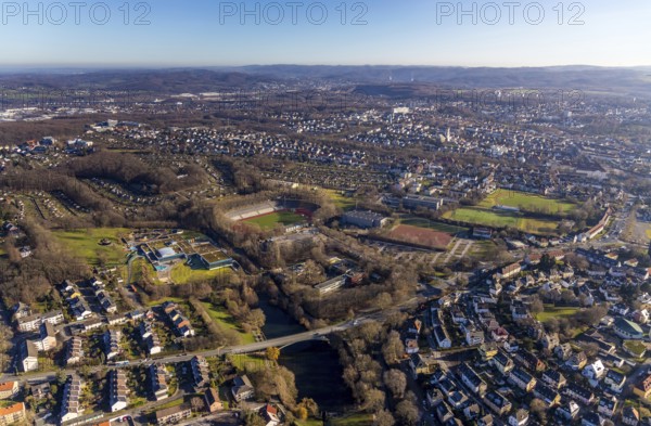 Aerial view, residential area Altenhagen, Westfalenbad, Stadionstraße, Sportpark Ischeland, Ischelandstadion, Ischelandhalle, Theodor-Heuss-Gymnasium, Hagen, Ruhr area, North Rhine-Westphalia, Germany, arena, bathing establishment, bathing resort, education, educational institution, Brücke Alexanderstraße, DE, Europe, distant view, open-air swimming pool, open-air grounds, leisure pool, football pitch, football stadium, football club, grammar school, Humpertstraße, Ischelandteich, allotment garden site, allotment garden association, Kleingärtnerverein Ischeland e. V., Ischeland e.V., Krollmann Arena, educational institute, aerial view, aerial photography, aerial photography, Meinolfschule Städt.Kath.Grundschule, allotment garden, school, swimming pool, swimming pool, Spiel- und Sportverein (SSV) Hagen-Fußball e.V., sport, sports ground, stadium, overview, bird's-eye view, birds-eyes view, overview