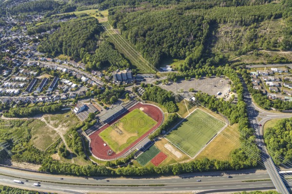 Aerial view, stadium above ground high voltage road, high voltage pylons, planned HStädt. building yard, Hagen-Hohenlimburg, Ruhr area, North Rhine-Westphalia, Germany, construction site, Corona measures, DE, Europe, football pitch, football stadium, football club, high-rise buildings, Kirchenberg, aerial view, aerial photography, aerial photography, renovation, sports, sports facilities, sports field, sports facility, stadium, training sessions, overview, bird's-eye view, overview