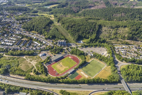 Aerial view, stadium above ground high voltage road, high voltage pylons, planned HStädt. building yard, Hagen-Hohenlimburg, Ruhr area, North Rhine-Westphalia, Germany, construction site, Corona measures, DE, Europe, football pitch, football stadium, football club, high-rise buildings, Kirchenberg, aerial view, aerial photography, aerial photography, renovation, sports, sports facilities, sports field, sports facility, stadium, training sessions, overview, bird's-eye view, overview