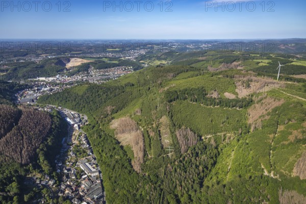 Aerial view, planned wind power plants, industrial area Obernahmerstraße, district Nahmer, quarry Steltenberg, Hagen-Hohenlimburg, Ruhr area, North Rhine-Westphalia, Germany, forestation, DE, Europe, distant view, commercial enterprises, commercial area, commercial site, commercial use, Hagen, Hohenlimburger Kalkwerke GmbH, hilly landscape, industrial area, industrial site, landscape conservation area, aerial view, aerial photography, aerial photography, nature conservation, nature reserve, quarry, open-cast mine, valley, overview, bird's-eye view, forest, forest area, forest damage, forest dieback, birds-eyes view, overview, thyssenkrupp Hohenlimburg GmbH