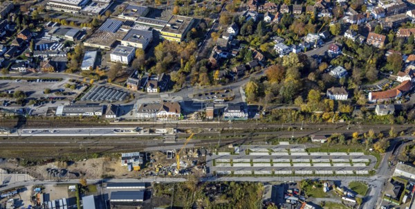 Aerial view, Haltern station, construction site conversion to a barrier-free station, Holtwicker Straße school centre, Haltern-Stadt, Haltern am See, Ruhr area, North Rhine-Westphalia, Germany, Alexander-Lebenstein-Realschule, railway tracks, railway station, station car park, construction work, construction area, construction site, building plots, construction project, construction site, education, educational institution, DE, Deutsche Bahn AG, through station, Europe, grammar school, main station, main railway station, Joseph-König-Gymnasium, teaching institute, aerial view, aerial photography, aerial photography, school, overview, conversion work, bird's-eye view, overview, autumn, autumn leaves, golden October, autumnal, Park & Ride car park, Park and Ride