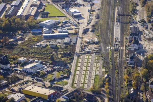 Aerial view, Haltern station, construction site conversion to a barrier-free station, Haltern town, Haltern am See, Ruhr area, North Rhine-Westphalia, Germany, railway tracks, station, station car park, construction work, construction area, building site, building plots, construction project, construction site, DE, Deutsche Bahn AG, through station, Europe, main station, central station, aerial view, aerial photography, aerial photography, overview, conversion work, bird's eye view, birds-eyes view, overview, autumn, autumn leaves, golden October, autumnal, Park & Ride car park, Park and Ride