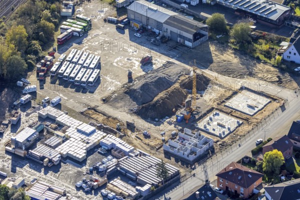 Aerial view, construction site new building flats, former company premises Klostermann, Annabergstraße, Haltern-Stadt, Haltern am See, Ruhr area, North Rhine-Westphalia, Germany, construction work, construction, construction area, building site, building plots, construction crane, construction project, construction site, Buses, DE, Europe, aerial view, aerial photography, aerial photography, new building, photovoltaic, photovoltaic plant, recycling yard, solar, solar plant, solar energy, solar energy, overview, bird's-eye view, birds-eyes view, overview, autumn, autumn leaves, golden October, autumnal
