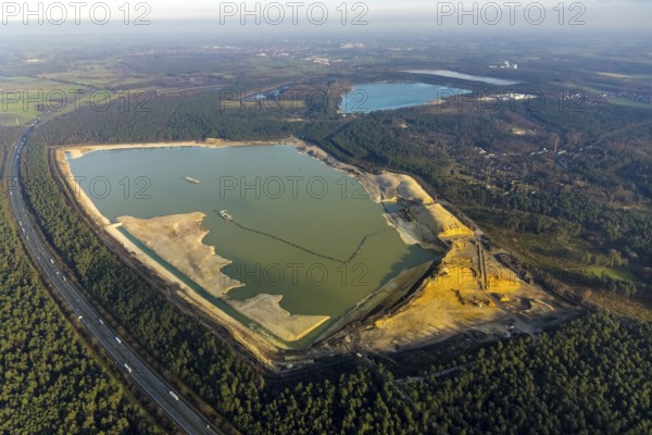 Aerial view of the Silbersee with quartz sand extraction in a forest area in the district Lehmbraken in Haltern am See in the Ruhr area in North Rhine-Westphalia, Germany, motorway A43, bathing lake, DE, Europe, Haltern am See, aerial view, aerial photography, aerial photograph, aerial photography, North Rhine-Westphalia, quartz sand extraction, Ruhr area, lake, overview, bird's eye view, forest area, birds-eyes view, overview