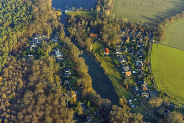 SIEDLUNG OVERRATH 16.12.2020 Village centre on the banks of the Stever - river course in Siedlung Overrath in the state of North Rhine-Westphalia, Germany // Village on the banks of the area Stever - river course in Siedlung Overrath in the state North Rhine-Westphalia, Germany. Photo: Hans Blossey, aerial view, aerial photograph, aerial photography, aerial photography, aerial photo, aerial photograph, aerial picture, Europe, Germany, North Rhine-Westphalia, settlement Overrath, place, settlement, streets, infrastructure, buildings, houses, residential area, river, waterway, course, distance, shore, water, // aerial photo, aerial photography, aerial picture, aerial view, air photo, Europe, North Rhine-Westphalia, Place, settlement, roads, infrastructure, buildings, houses, residential, river, waterway, course, distance, shore, water