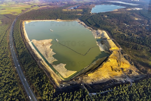Aerial view of the Silbersee with quartz sand extraction in a forest area in the district Lehmbraken in Haltern am See in the Ruhr area in North Rhine-Westphalia, Germany, motorway A43, bathing lake, DE, Europe, Haltern am See, aerial view, aerial photography, aerial photograph, aerial photography, North Rhine-Westphalia, quartz sand extraction, Ruhr area, lake, overview, bird's eye view, forest area, birds-eyes view, overview