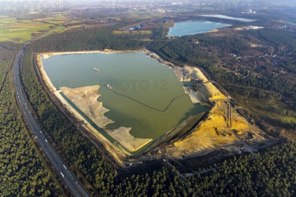 Aerial view of the Silbersee with quartz sand extraction in a forest area in the district Lehmbraken in Haltern am See in the Ruhr area in North Rhine-Westphalia, Germany, motorway A43, bathing lake, DE, Europe, Haltern am See, aerial view, aerial photography, aerial photograph, aerial photography, North Rhine-Westphalia, quartz sand extraction, Ruhr area, lake, overview, bird's eye view, forest area, birds-eyes view, overview