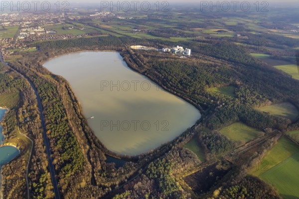 Aerial view of Silbersee III with Quarzwerke GmbH - Haltern plant for quartz sand extraction in the Lehmbraken district in the forest area in Haltern am See in the Ruhr area in North Rhine-Westphalia, Germany, DE, Europe, commercial enterprises, commercial area, commercial park, commercial location, commercial use, Haltern am See, industrial area, industrial building, industrial site, aerial view, aerial photograph, aerial photography, aerial photography, North Rhine-Westphalia, quartz sand extraction, Ruhr area, lake, overview, bird's-eye view, overview