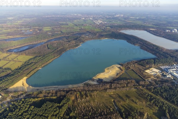 Aerial view of Silbersee II and Silbersee II in the forest area with KSPE Kalksandstein-Planelemente Verwaltungsgesellschaft mbH for quartz sand extraction in the district of Lehmbraken in Haltern am See in the Ruhr area in North Rhine-Westphalia, Germany, bathing lake, DE, Europe, commercial enterprises, commercial area, industrial estate, commercial park, commercial site, commercial use, Haltern am See, industrial area, industrial building, industrial site, aerial view, aerial photograph, aerial photography, aerial photography, North Rhine-Westphalia, quartz sand extraction, Ruhr area, lake, overview, bird's-eye view, forest area, birds-eyes view, overview
