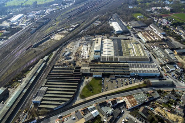 Aerial view, construction site on the WDI site between the railway embankment and Otto-Brenner-Straße, Hamm, Ruhr area, North Rhine-Westphalia, Germany, DE, Europe, birds-eyes, view, aerial view, aerial photography, aerial photography, overview, overview, bird's eye view, railway line, railway network, infrastructure, transport, train traffic, freight traffic, railway network, metal processing, metalworking, industry, production, workplaces