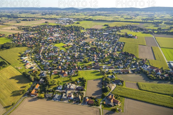 Aerial view, town view Bohlen, Hille, Ostwestfalen-Lippe, OWL, North Rhine-Westphalia, Germany, Bastauwiesen landscape conservation area, DE, Europe, distant view, Großes Torfmoor, property tax, real estate, aerial view, aerial photography, aerial photography, OWL book, OWL book, local view, East Westphalia book, townscape, urban area, overview, bird's-eye view, meadows and fields, housing estate, housing and living, residential area, residential buildings, housing quality, residential neighbourhood, housing estate, birds-eyes view, overview