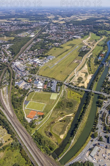 Aerial view, construction site Erlebensraum Lippeaue, Datteln-Hamm-Canal, Hammer Technologie- und Gründerzentrum Hamtec, sports fields of HTC Hockey- und Tennisclub, airfield EDLH, Hamm, shopping centre Alleecenter, Ruhr area, North Rhine-Westphalia, Germany, DE, Europe, birds-eyes, view, aerial view, aerial photography, aerial photography, overview, overview, bird's-eye view, Lippe, Hamm-Datteln-Kanal, shopping, food, clothing, consumption, consumer, technology centre, technology, company, development, waterway, shipping, transport, logistics, goods movement, ships, waters, goods, shopping, textiles, airfield, flying, air sports, leisure, pilot
