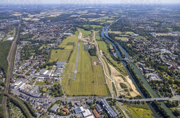 Aerial view, construction site Erlebensraum Lippeaue, Datteln-Hamm-Canal, Hammer Technologie- und Gründerzentrum Hamtec, sports fields of HTC Hockey- und Tennisclub, airfield EDLH, Hamm, shopping centre Alleecenter, Ruhr area, North Rhine-Westphalia, Germany, DE, Europe, birds-eyes, view, aerial view, aerial photography, aerial photography, overview, overview, bird's-eye view, Lippe, Hamm-Datteln-Kanal, shopping, food, clothing, consumption, consumer, technology centre, technology, company, development, waterway, shipping, transport, logistics, goods movement, ships, waters, goods, shopping, textiles, airfield, flying, air sports, leisure, pilot