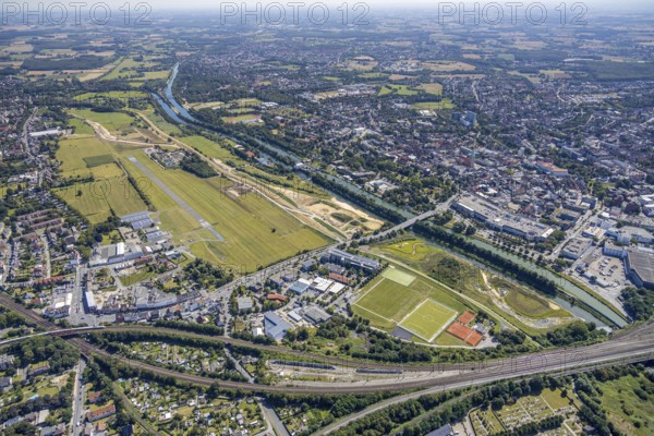 Aerial view, construction site Erlebensraum Lippeaue, Datteln-Hamm-Canal, Hammer Technologie- und Gründerzentrum Hamtec, sports fields of HTC Hockey- und Tennisclub, airfield EDLH, Hamm, shopping centre Alleecenter, Ruhr area, North Rhine-Westphalia, Germany, DE, Europe, birds-eyes, view, aerial view, aerial photography, aerial photography, overview, overview, bird's-eye view, Lippe, Hamm-Datteln-Kanal, shopping, food, clothing, consumption, consumer, technology centre, technology, company, development, waterway, shipping, transport, logistics, goods movement, ships, waters, goods, shopping, textiles, airfield, flying, air sports, leisure, pilot