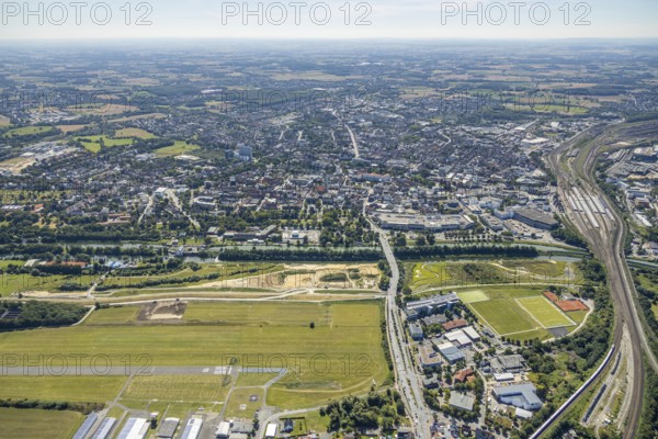 Aerial view, construction site Erlebensraum Lippeaue, Datteln-Hamm-Canal, Hammer Technologie- und Gründerzentrum Hamtec, sports fields of HTC Hockey- und Tennisclub, airfield EDLH, Hamm, shopping centre Alleecenter, Ruhr area, North Rhine-Westphalia, Germany, DE, Europe, birds-eyes, view, aerial view, aerial photography, aerial photography, overview, overview, bird's-eye view, Lippe, Hamm-Datteln-Kanal, shopping, food, clothing, consumption, consumer, technology centre, technology, company, development, waterway, shipping, transport, logistics, goods movement, ships, waters, goods, shopping, textiles, airfield, flying, air sports, leisure, pilot