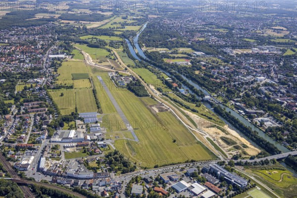 Aerial view, construction site Erlebensraum Lippeaue, Datteln-Hamm-Canal, Hammer Technologie- und Gründerzentrum Hamtec, sports fields of HTC Hockey- und Tennisclub, airfield EDLH, Hamm, shopping centre Alleecenter, Ruhr area, North Rhine-Westphalia, Germany, DE, Europe, birds-eyes, view, aerial view, aerial photography, aerial photography, overview, overview, bird's-eye view, Lippe, Hamm-Datteln-Kanal, shopping, food, clothing, consumption, consumer, technology centre, technology, company, development, waterway, shipping, transport, logistics, goods movement, ships, waters, goods, shopping, textiles, airfield, flying, air sports, leisure, pilot