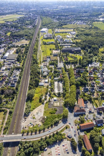 Aerial view, railway line Heessen direction Hamm, bridge over the railway line Dasbecker Weg, Heessen, Hamm, Ruhr area, North Rhine-Westphalia, Germany, DE, Europe, birds-eyes, view, aerial photograph, aerial photography, aerial photography, overview, bird's eye view, Hamm-Heessen, railway line, railway network, infrastructure, traffic, train traffic, freight traffic, railway network, transport, traffic, logistics, road traffic