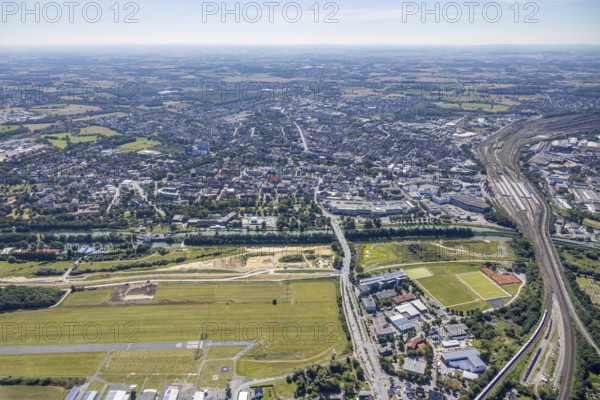 Aerial view, construction site Erlebensraum Lippeaue, Datteln-Hamm-Canal, Hammer Technologie- und Gründerzentrum Hamtec, sports fields of HTC Hockey- und Tennisclub, airfield EDLH, Hamm, shopping centre Alleecenter, Ruhr area, North Rhine-Westphalia, Germany, DE, Europe, birds-eyes, view, aerial view, aerial photography, aerial photography, overview, overview, bird's-eye view, Lippe, Hamm-Datteln-Kanal, shopping, food, clothing, consumption, consumer, technology centre, technology, company, development, waterway, shipping, transport, logistics, goods movement, ships, waters, goods, shopping, textiles, airfield, flying, air sports, leisure, pilot