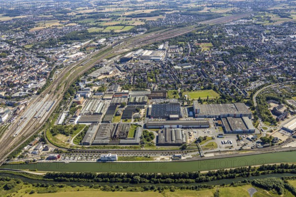 Aerial view, overview industrial area at the canal, former Thyssen site, Hafenstraße, Westlich Bahnhof, Hamm, Ruhr area, North Rhine-Westphalia, Germany, DE, Europe, birds-eyes, view, aerial view, aerial photography, aerial photography, overview, bird's eye view, Datteln-Hamm Canal, water, waterways, shipping, transport, logistics, goods, trade, infrastructure, industrial area, industry, manufacturing, production, train traffic, railway traffic, traffic connection, travel, holiday, waterway, goods movement, ships, waters