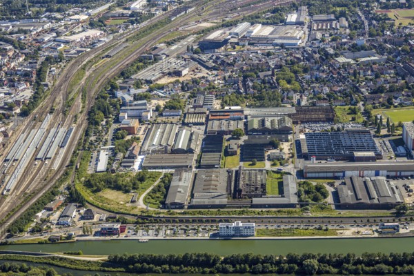 Aerial view, overview industrial area at the canal, former Thyssen site, Hafenstraße, Westlich Bahnhof, Hamm, Ruhr area, North Rhine-Westphalia, Germany, DE, Europe, birds-eyes, view, aerial view, aerial photography, aerial photography, overview, bird's eye view, Datteln-Hamm Canal, water, waterways, shipping, transport, logistics, goods, trade, infrastructure, industrial area, industry, manufacturing, production, train traffic, railway traffic, traffic connection, travel, holiday, waterway, goods movement, ships, waters