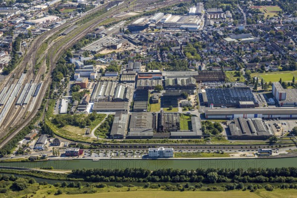 Aerial view, overview industrial area at the canal, former Thyssen site, Hafenstraße, Westlich Bahnhof, Hamm, Ruhr area, North Rhine-Westphalia, Germany, DE, Europe, birds-eyes, view, aerial view, aerial photography, aerial photography, overview, bird's eye view, Datteln-Hamm Canal, water, waterways, shipping, transport, logistics, goods, trade, infrastructure, industrial area, industry, manufacturing, production, train traffic, railway traffic, traffic connection, travel, holiday, waterway, goods movement, ships, waters
